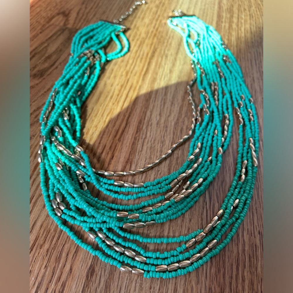 Charming Charlie turquoise and gold colored beaded layered necklace